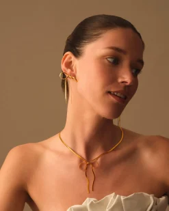 Katie Loxton Amelie Waterproof Gold Bow Oversized Earrings Sale